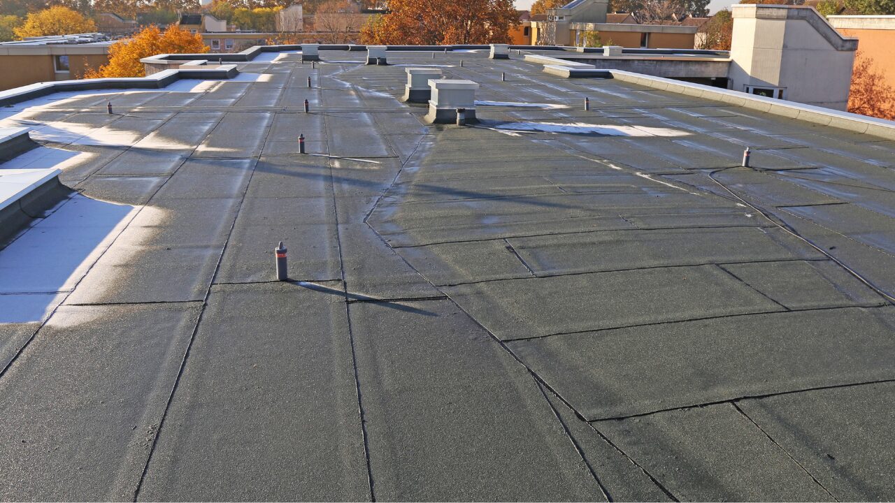 Renovated flat roof with sealed surface