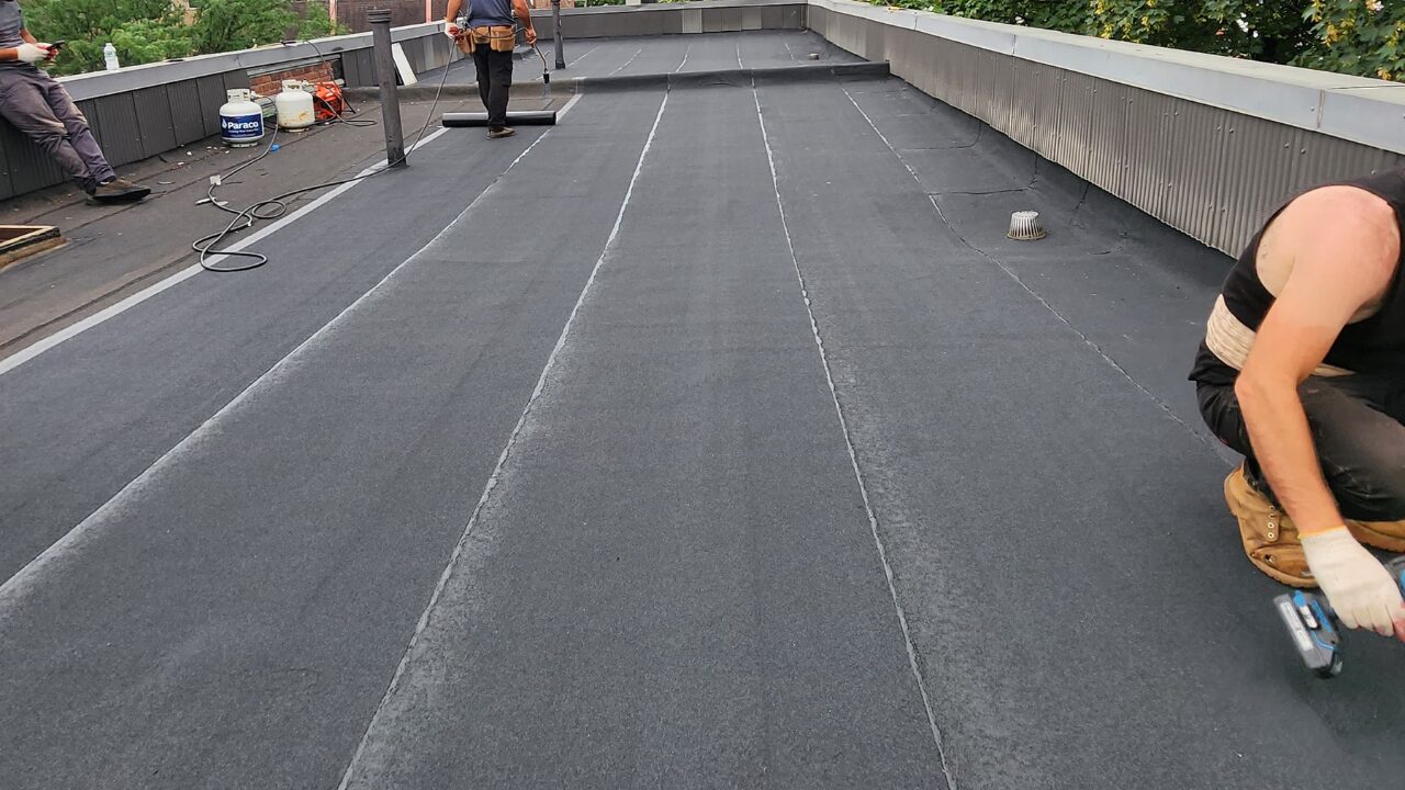 Flat roof waterproofing repair in progress