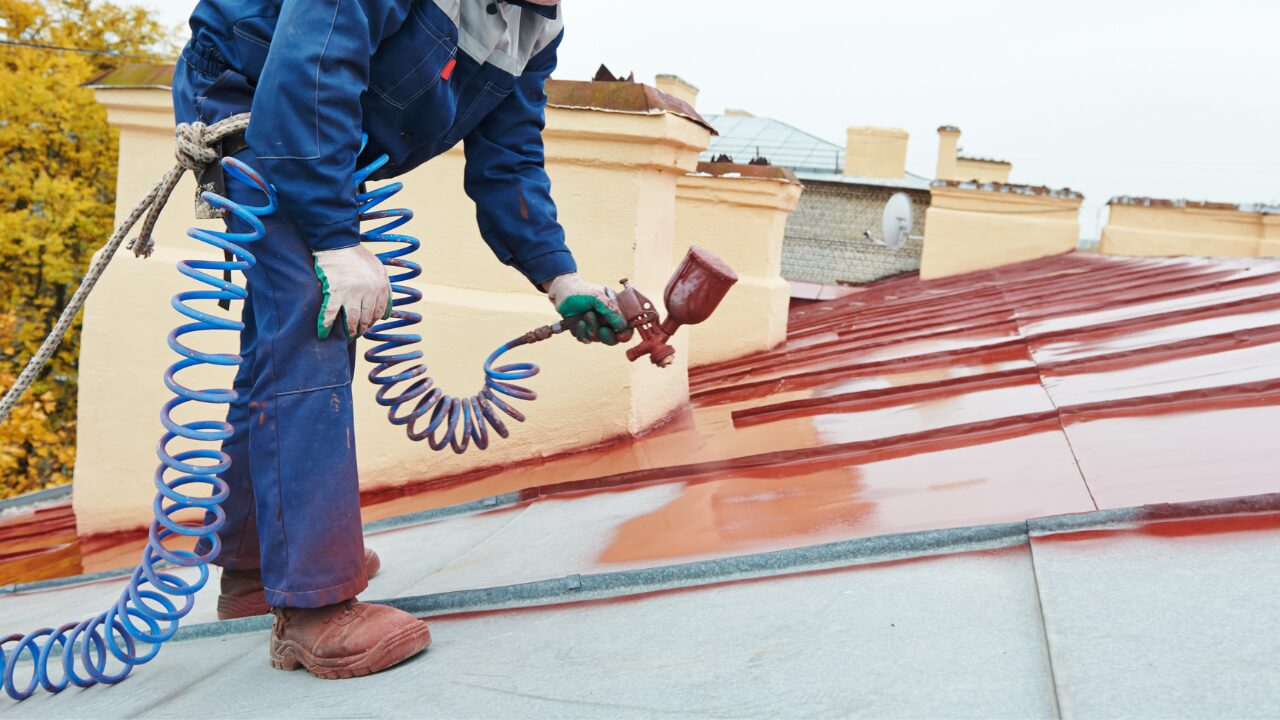 Roof spray painting in progress